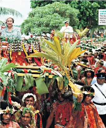  ??  ?? CARRIED AWAY The Queen is held aloft on a trip to Tuvalu in 1982