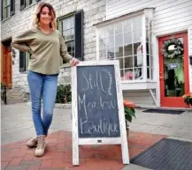  ?? JEFF TAYLOR/THE WINCHESTER STAR VIA AP ?? Lacey Larrick poses in 2021 outside the Still Meadow Boutique in Winchester, Va.