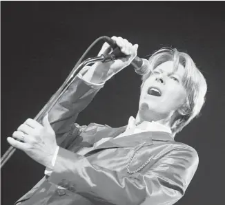  ?? MARTIN BUREAU/AFP/GETTY IMAGES ?? British rock icon David Bowie broke a decade-long silence on Jan. 8, unveiling a new single, Where are We Now?, to coincide with his 66th birthday and announcing he will release an album in March.