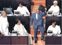  ??  ?? Sri Lankan Finance Minister Mangala Samaraweer­a shows a briefcase containing the 2019 budget proposals as he arrives at the parliament in Colombo on Tuesday. — Reuters