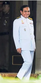  ?? — AFP ?? Exiting the grounds: Prayut leaving Government House in Bangkok a day after the general election.