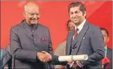  ?? HT ?? President Ram Nath Kovind presenting an award to an NRI during the 15th Pravasi Bharatiya Divas, in Varanasi on Wednesday