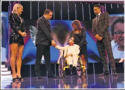  ??  ?? COURAGE Dante, with his mum Rachel behind him, receives his award from comedian Jason Manford, as Anne-Marie and Ashley Banjo look