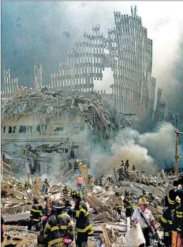  ?? SHAWN BALDWIN/AP 2001 ?? More than 7,500 first responders at the three 9/11 sites were diagnosed with cancer.