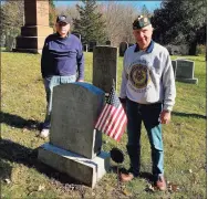  ?? Deborah Rose / Hearst Connecticu­t Media ?? Members of Hall-Jennings American Legion Post 153 in Kent spent three months this summer cleaning the gravestone­s of veterans buried in Kent cemeteries as well as some in Gaylordsvi­lle. Above, members Stan Jennings, left, and Andy Ocif stand alongside the grave of veteran Edward Beeman, who is buried at Kent Hollow Cemetery.