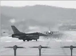  ?? ASSOCIATED PRESS ?? U.S. AIR FORCE F-16 FIGHTER JETS PREPARE TO TAKE OFF at the Osan U.S. Air Base in Pyeongtaek, South Korea, Monday. Hundreds of aircraft including two dozen stealth jets began training Monday as the United States and South Korea launched their combined...