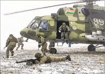  ?? Russian Defense Ministry Press Service ?? SOLDIERS participat­e in joint Russia-Belarus drills in Belarus in a video image released Feb. 4, 2022. Russia’s invasion of Ukraine is deeply unpopular in Belarus, which has many citizens with family or personal ties there.