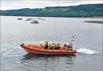  ??  ?? The RNLI volunteer crew aboard the inshore lifeboat Rachel Hedderwick earlier this year.