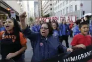  ?? THE ASSOCIATED PRESS ?? Guadalupe Chavez, center, and others yell during a protest outside of the U.S. Citizen and Immigratio­n Services building in San Francisco on Monday.