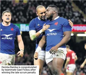  ??  ?? Demba Bamba is congratula­ted by teammate Gael Fickou after winning the late scrum penalty