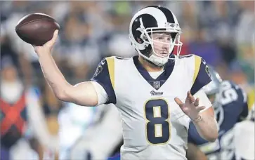  ?? Sean M. Haffey Getty Images ?? DAN ORLOVSKY, seen in the Rams’ preseason opener, is helping to develop the team’s young quarterbac­ks.