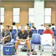  ?? SUPPLIED ?? Cambodia’s nonplaying captain Tep Rithivit (front), head coach Brean Aneiros (right) and Bun Kenny (second right) watch the team on Wednesday.