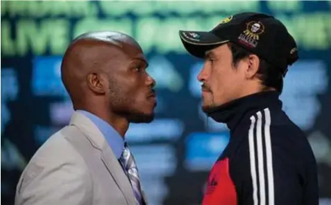  ??  ?? Boxers Timothy Bradley, left, and Juan Manuel Marquez face off for photograph­ers after a news conference in Las Vegas. Bradley is scheduled to defend his WBO welterweig­ht title against Juan Manuel Marquez on Saturday.