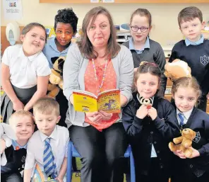  ??  ?? Reading time Irene McAlpine from education resources treats Chapelton Primary’s pupils to a Horrid Henry tale