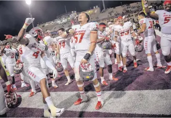  ?? ROBERTO E. ROSALES/JOURNAL ?? Lobo players celebrate in the end zone after defeating the Aggies in Las Cruces in 2018.