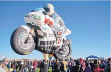  ?? MARLA BROSE/JOURNAL ?? A crowd pleaser, the special-shape balloon Superbike rides off into the sky during Saturday’s mass ascension.