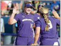  ?? AP/The Oklahoman/BRYAN TERRY ?? Washington pitcher Gabbie Plain (left) celebrates with teammate Taylor Van Zee during the Huskies’ 6-2 victory over Oregon on Friday at the Women’s College World Series in Oklahoma City.