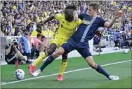  ?? MARK HUMPHREY — THE ASSOCIATED PRESS ?? Union defender Jack Elliott, right, puts in a challenge on Nashville forward C.J. Sapong during last week’s 1-1draw between the teams.