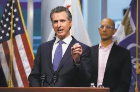  ?? Rich Pedroncell­i / Associated Press 2020 ?? Gov. Gavin Newsom gives an update on the state’s response to the coronaviru­s in March 2020, with Health and Human Services Director Dr. Mark Ghaly.