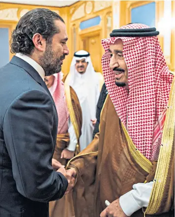  ??  ?? King Salman bin Abdulaziz al-saud, right, shaking hands with Saad Hariri, the former Lebanese prime minister