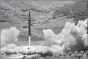  ?? ASSOCIATED PRESS ?? THIS JULY 4 FILE PHOTO distribute­d by the North Korean government shows what was said to be the launch of a Hwasong-14 interconti­nental ballistic missile in North Korea.
