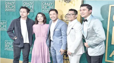  ?? — AFP photo ?? (From left): Steven Yeun, Jae Suh Park, Randall Park, Daniel Dae Kim and Henry Golding during the premiere of Warner Bros. Pictures’ “Crazy Rich Asians”in Hollywood.