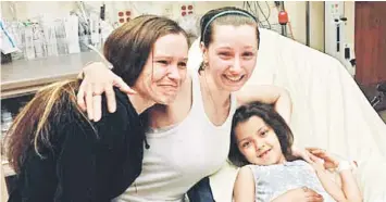  ??  ?? FAMILY REUNION: This image shows Amanda Berry (centre) reunited with her sister (left) in Cleveland, Ohio after Berry and two other women who had been missing for a decade were found alive in a house not far from where they were last seen. — AFP photo