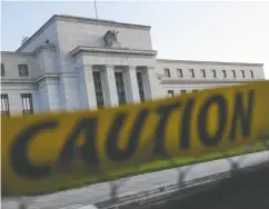  ?? KEVIN DIETSCH / GETTY IMAGES FILES ?? As 2024 began, many investors expected the U.S. Federal Reserve to cut rates up to seven times this year. Markets now forecast just one or two cuts, Katie Martin writes.