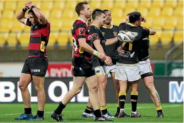  ?? PHOTO: GETTY IMAGES ?? Regan Verney celebrates another Wellington try with team-mates Jackson Garden-Bachop, Malo Tuitama and Sheridan Rangihuna as Canterbury players seem stunned by the onslaught from the Lions.