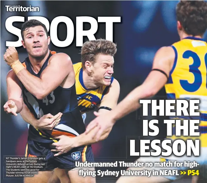  ?? Picture: JUSTIN KENNEDY ?? NT Thunder’s Jarred Erlandson gets a handpass away as the Sydney University defence arrives during last night’s NEAFL clash at TIO Stadium. The Students were too good for Thunder winning by 68 points