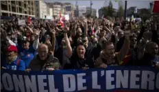  ?? Daniel Cole/Associated Press ?? Protesters gather Tuesday at a demonstrat­ion in Marseille, southern France, expressing anger at a bill raising the retirement age to 64, which unions see as a broader threat to the French social model.