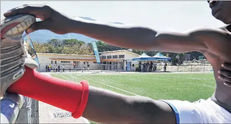  ?? Picture: COURTNEY AFRICA ?? VIEW TO CHANGE: Luphelo Dantjie limbers up yesterday at the upgraded Hout Bay Sports Complex, which the city hopes will unite the surroundin­g communitie­s.