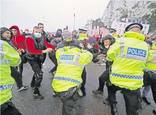  ?? Picture: PA ?? Police hold back drivers trying to enter the Port of Dover in Kent