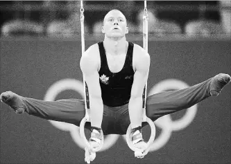  ?? THE ASSOCIATED PRESS FILE PHOTO ?? Canada’s gymnast Kyle Shewfelt performs at the rings during the men’s qualificat­ion rounds at the Beijing 2008 Olympics in Beijing, on Aug. 9, 2008.