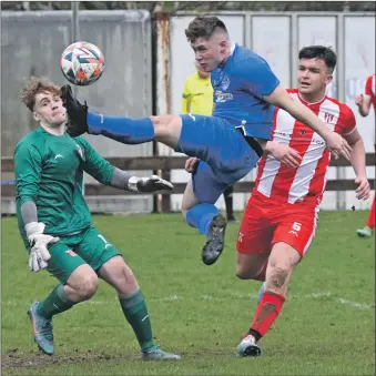  ?? ?? Airborne in the goalmouth, Mallaig’s Sam MacKenzie avoids a tackle from John Gillies and keeper Fraser Gillies.