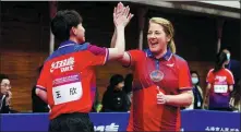  ?? GAO ERQIANG / CHINA DAILY ?? Ping-pong players from China and the United States celebrate in Shanghai on Saturday during a friendly match marking the 50th anniversar­y of the two countries’ Ping-Pong Diplomacy.