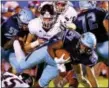  ?? BOB RAINES — DIGITAL FIRST MEDIA ?? North Penn’s Khan Jamal gets tripped up by Central Bucks East’s Tyler Tracy Friday night.