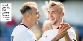  ??  ?? Kamil Grosicki and Jarrod Bowen