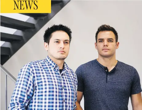  ?? CHRISTOPHE­R KATSAROV / THE CANADIAN PRESS ?? Klever Freire, left, and Gabriel Otrin found themselves stuck in an elevator Tuesday evening with floodwater­s quickly rising around them.