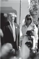  ?? MEGHAN MCCARTHY/PALM BEACH DAILY NEWS ?? Donald Trump, accompanie­d by his wife, Melania, again spoke out against a New York state ruling on his business empire after the couple cast votes in Tuesday’s Florida presidenti­al primary election.