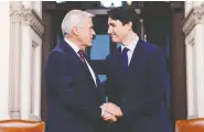  ?? SEAN KILPATRICK/THE CANADIAN PRESS ?? Prime Minister Justin Trudeau meets with Newfoundla­nd and Labrador Premier Dwight Ball
on Parliament Hill in Ottawa on Tuesday.
