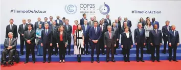  ?? AP ?? Spain’s caretaker Prime Minister Pedro Sanchez (centre), and UN Secretary-General António Guterres, with representa­tives taking part at the COP25 climate talks in Madrid yesterday.