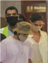  ??  ?? Actors Deepika Padukone and Ranveer Singh arrive at Mumbai Internatio­nal Airport, after the former was summoned by NCB in a drugs probe, on Thursday.