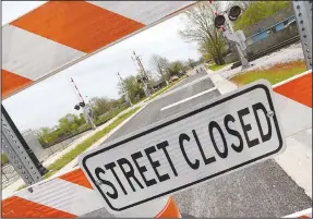  ?? (NWA Democrat-Gazette/Flip Putthoff) ?? A railroad crossing on Maple Street in Springdale is behind barricades. The city has spent nearly $500,000 for a new crossing of the Arkansas & Missouri Railroad’s tracks at West Maple Avenue. But railroad officials won’t let the crossing open. Go to nwaonline.com/210411Dail­y/ for today’s photo gallery.