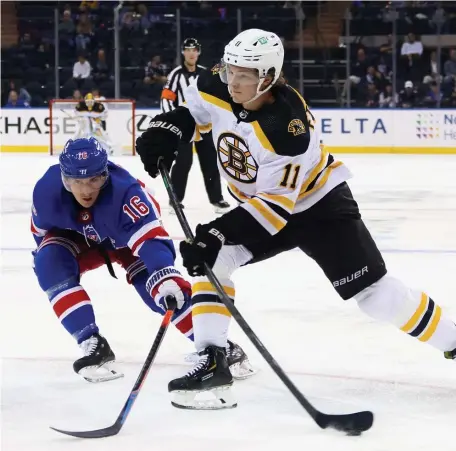  ?? GETTY IMAGES ?? WORKING ON IT: Bruins forward Trent Frederic takes a shot during Tuesday’s preseason game against the New York Rangers.