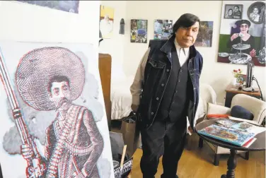  ?? Liz Hafalia / The Chronicle 2017 ?? René Yañez, at his home, gets ready to go out and do street art on a December day.