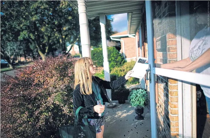  ??  ?? Hilde Lysiak, 10, out delivering her self-published newspaper.