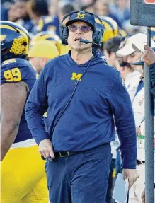  ?? Kevork Djansezian/getty Images ?? Michigan coach Jim Harbaugh now has a 1-3 record in the College Football Playoff after Monday’s win over Alabama.