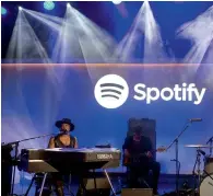  ?? Bloomberg ?? Singer D’Angelo performs at a Spotify media event in New York. Spotify has jumped out to a lead in the global race to acquire music subscriber­s. —