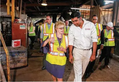  ?? Gary Fountain ?? The Small Business Administra­tion’s Linda McMahon tours Tejas Tubular with plant manager Karthik Nagarajan.